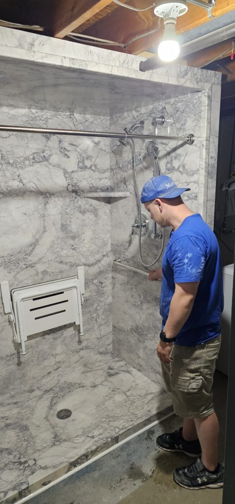 Contractors working on a bath installation in Chesterfield.
